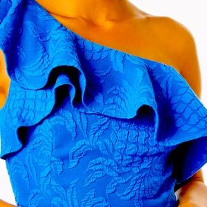 LILLY PULITZER
Kipton Skirted Romper in Blue Tang Pineapple Pucker Jacquard